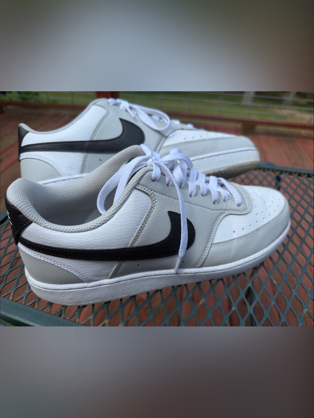Nike Men's White Leather Sneakers with Black Swoosh Accent